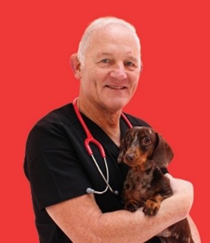 Mike Davies holding a small dog